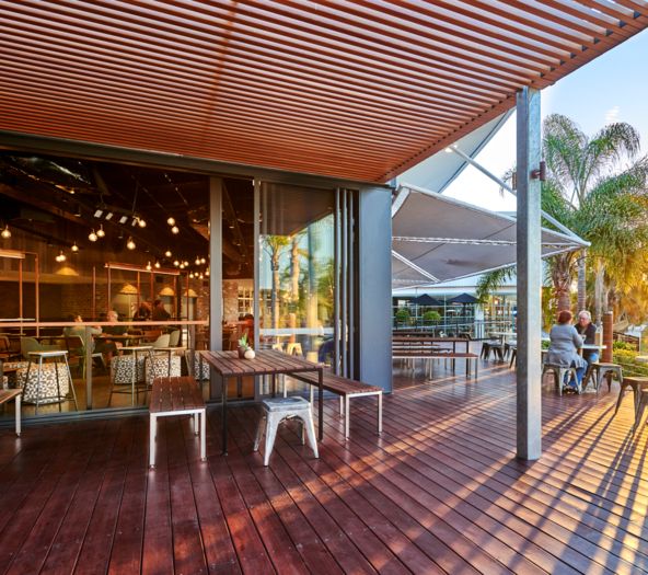 Panther's League Club modern outdoor deck design at sunset